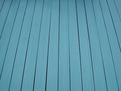 A wooden floor with a blue stain