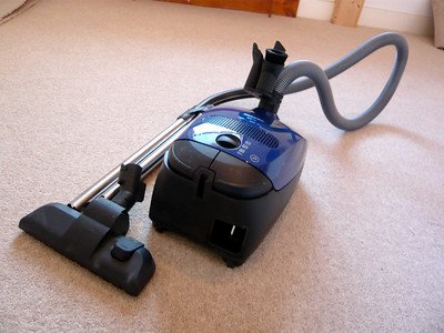 A cleaning equipment placed in a carpeted floor
