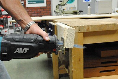 A close-up of the blade as it cuts through a piece of wood