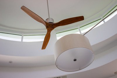 a wooden fan and a light