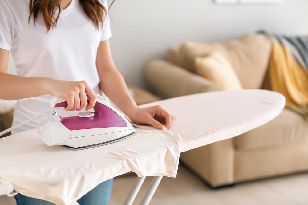 who invented the ironing board
